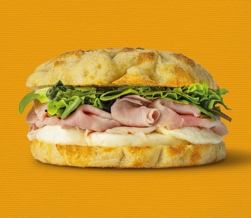 Focaccia with steamed ham, buffalo mozzarella and mixed greens